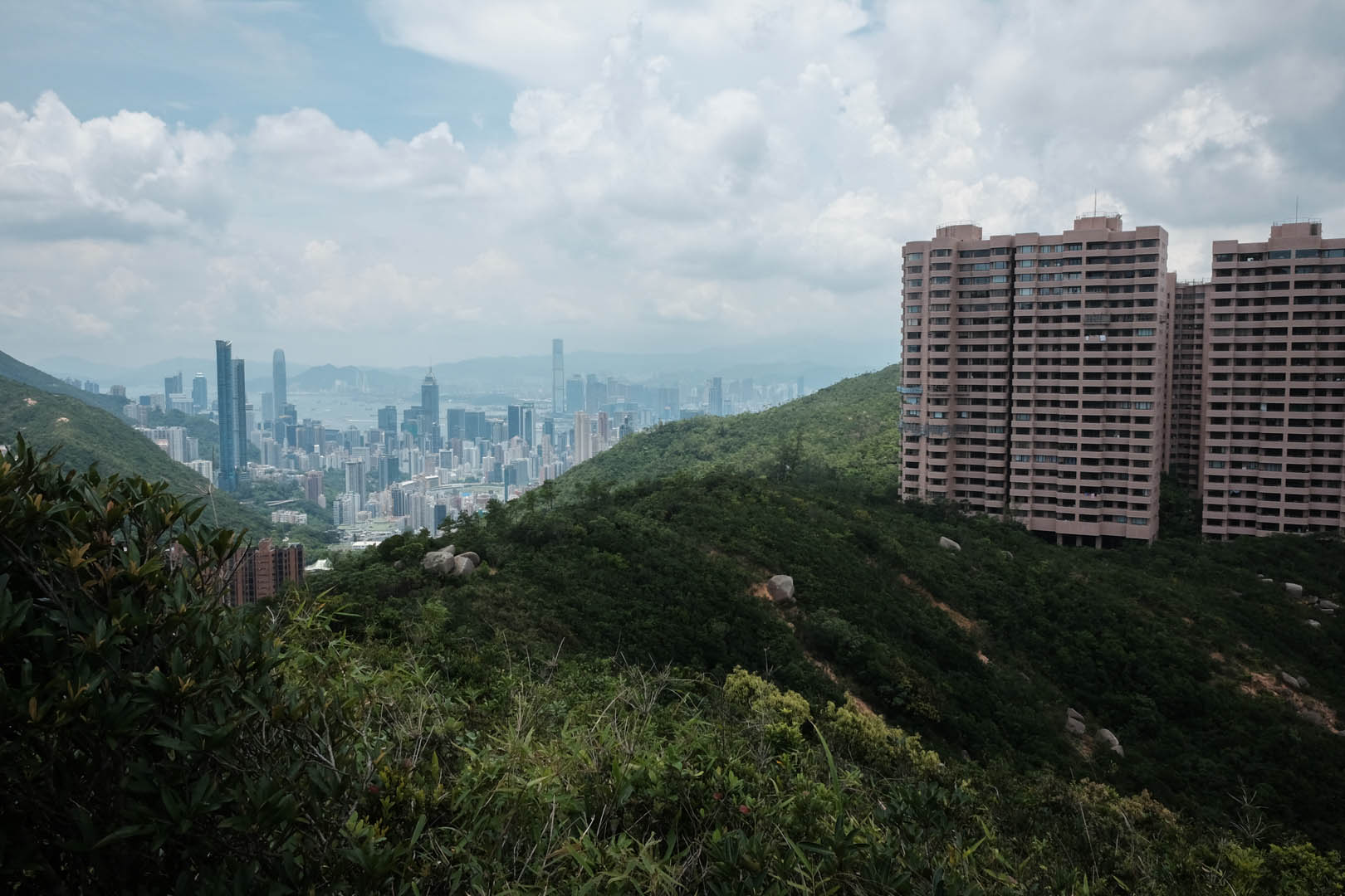 View of Parkview Heights and Island cityscape from the initial ascent to Violet Hill from Wong Nai Chung Reservoir